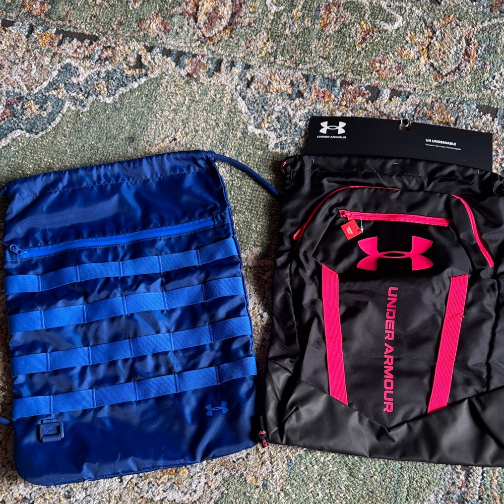 UNDER ARMOUR SET OF 2 SACKPACKS…ONE NEW WITH TAGS, OTHER GENTLY USED…NICE!